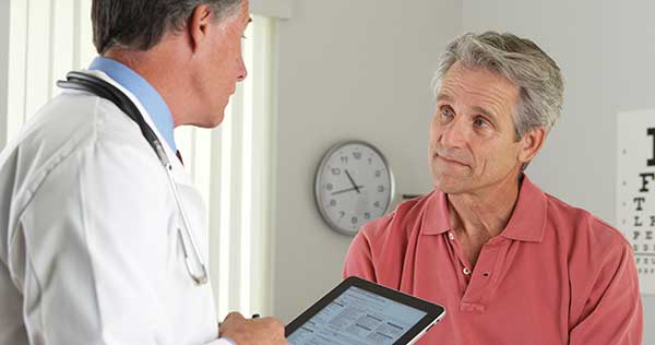 Doctor with patient discussing carpal tunnel treatment options