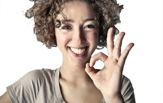 woman smiling after curing her carpal tunnel
