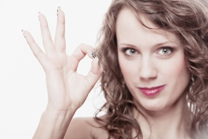Young woman gesturing ok okay hand sign beauty professionals with Carpal Tunnel