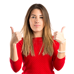 Young woman making Ok sign over white background