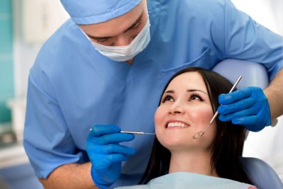 dentist working on a patient again after curing carpal tunnel