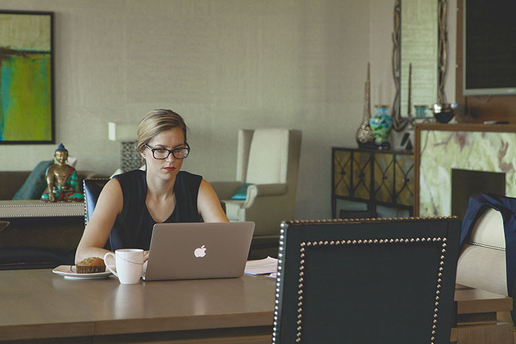 woman on laptop works with carpal tunnel computer programmer cures carpal tunnel