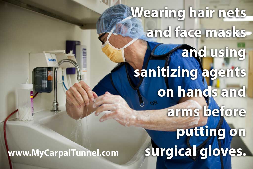 surgery-personnel-preventing-infection Wearing hair nets and face masks and using sanitizing agents on hands and arms before putting on surgical gloves